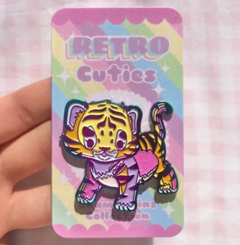 One of Nicole Ma's retro enamel pins.