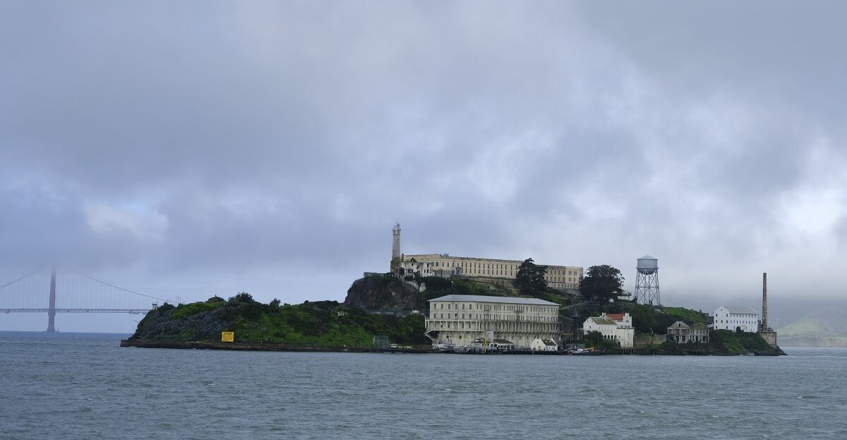 FILE - In this March 6, 2019, file photo, is Alcatraz Island in San Francisco. Alcatraz Island will reopen its outdoor areas to the public next week after being closed for five months due to the pandemic. The Mercury News reports Thursday, Aug. 13, 2020, the island that once housed Al Capone and George "Machine Gun" Kelly will reopen Monday but will be an outdoor-only experience, to reduce the risk of spreading COVID-19. (AP Photo/Eric Risberg, File)