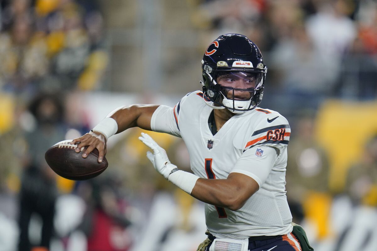 Chicago Bears quarterback Justin Fields (1) looks to pass against the Pittsburgh Steelers during the first half of an NFL football game, Monday, Nov. 8, 2021, in Pittsburgh. (AP Photo/Gene J. Puskar)