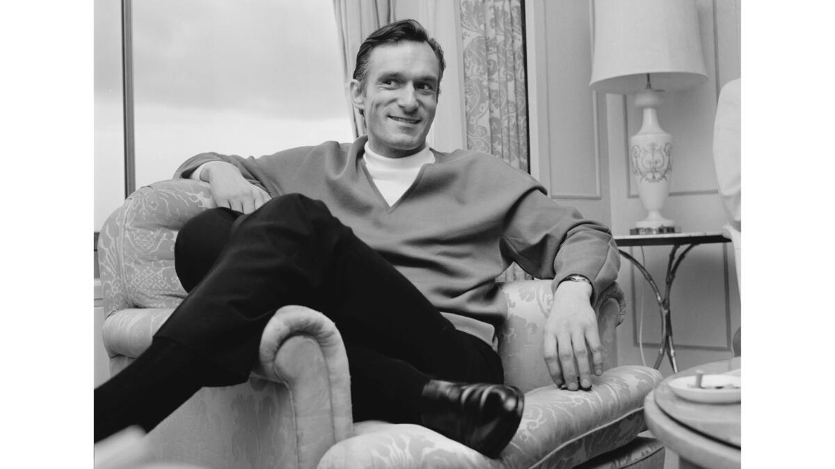 Hugh Hefner, founder of the Playboy empire, relaxes during a visit to England in 1966.