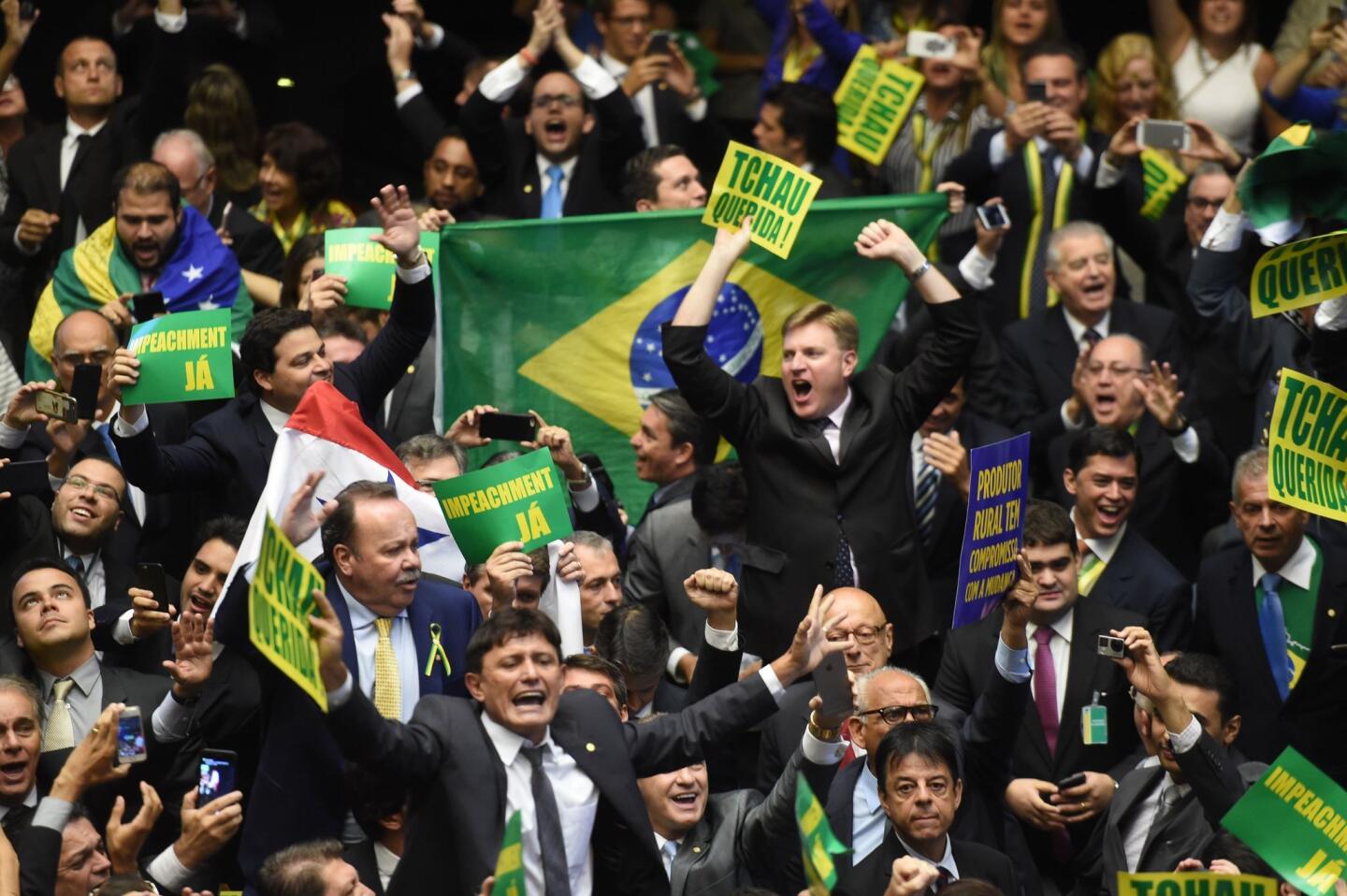 Brazil's lawmakers celebrate after a vote to authorize President Dilma Rousseff's impeachment in Congress in Brasilia.