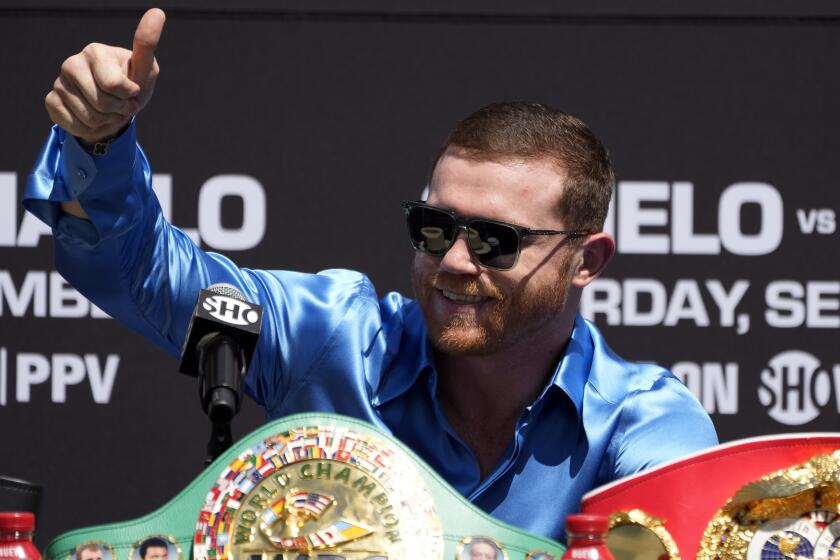 Undisputed super middleweight world champion Canelo Álvarez, of Mexico, greets the crowd.