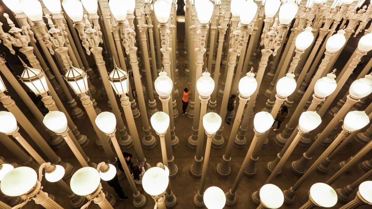 Artist Chris Burden's installation of 202 vintage streetlights, "Urban Light," at  the entrance to the Los Angeles County Museum of Art. 