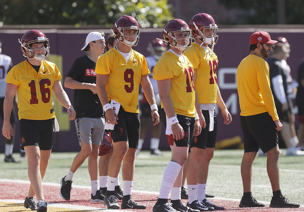 USC quarterback JT Daniels (18) at USC fall camp with teammates Scott Harris (16), Kedon Slovis (9) and Matt Fink (19).