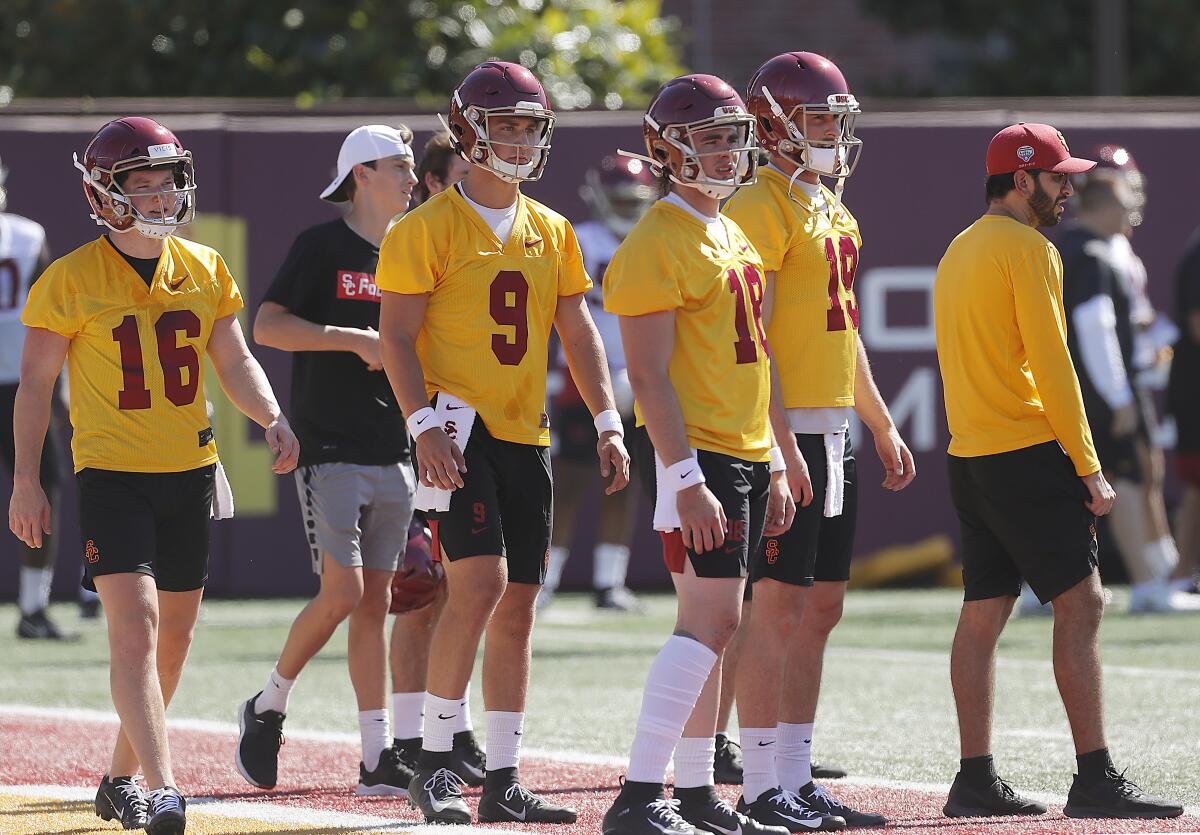 USC quarterback JT Daniels (18) at USC fall camp with teammates Scott Harris (16), Kedon Slovis (9) and Matt Fink (19). 