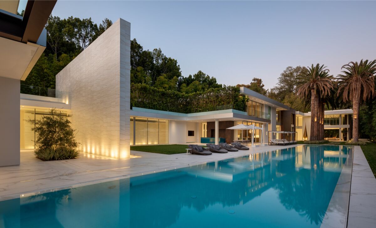 Spanning two acres in Bel-Air, the gated property holds a nearly 30,000-square-foot mansion, a 160-foot pool and a 30-foot water wall.