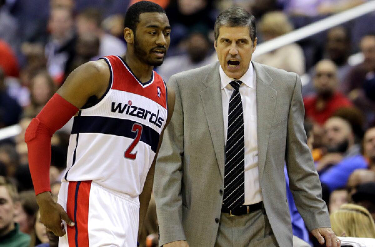 Wizards guard John Wall and Coach Randy Wittman were able to engineer a victory over the Lakers last week.