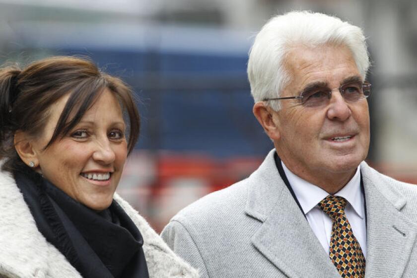 Celebrity publicist Max Clifford, accompanied by his wife, Jo Westwood arrives to testify at an unrelated inquiry into the conduct of Britain's tabloid media.