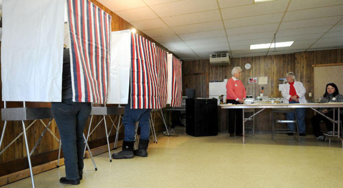 People vote at the WCR Hall in Macksburg, Iowa.
