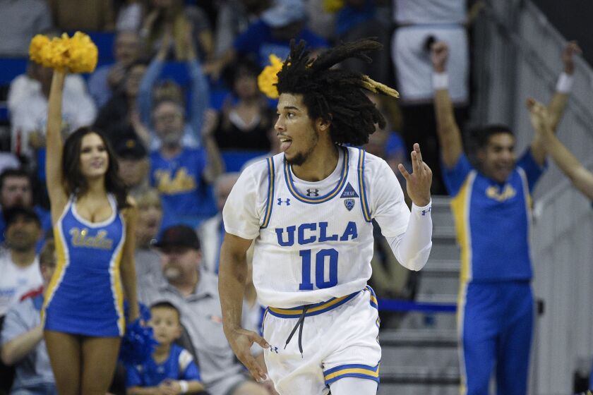 UCLA guard Tyger Campbell celebrates after making a three-point shot against Utah on Feb. 2 at Pauley Pavilion.