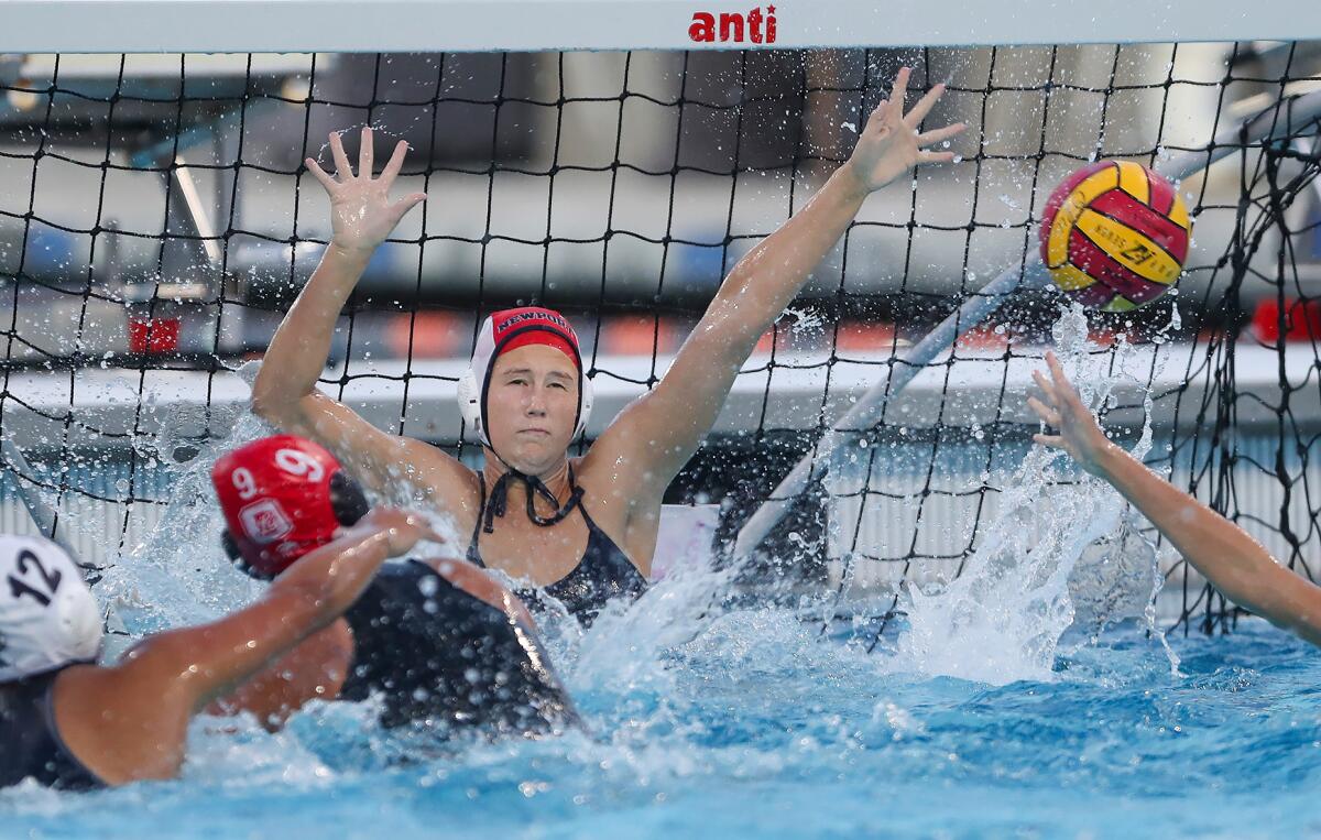 Newport Harbor goalie Lydia Soderberg reaches for a block against Orange Lutheran in the Open Division semifinals.