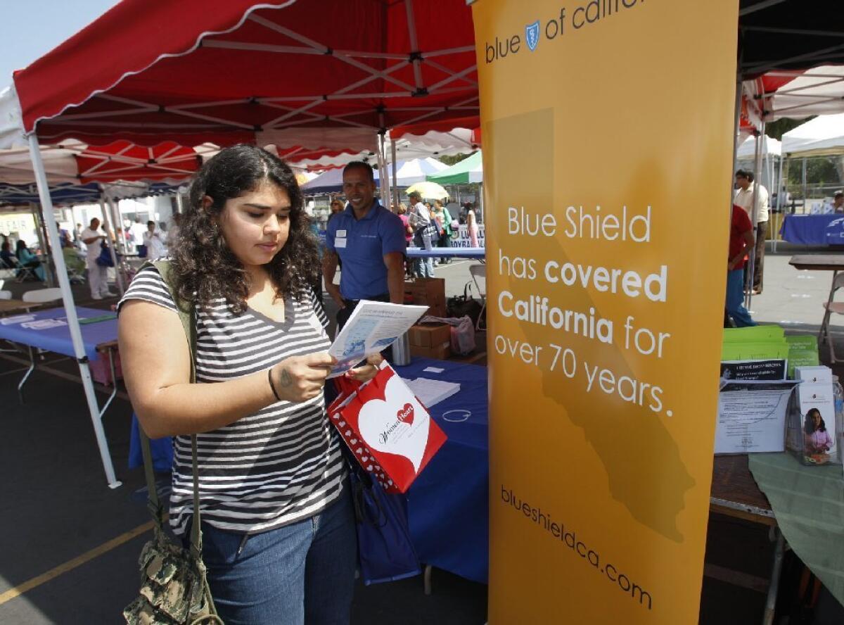 San Francisco health insurer Blue Shield of California is expanding into Medi-Cal by acquiring Care 1st Health Plan of Monterey Park. Above, Sophia Bracho of Los Angeles shops for coverage last year.