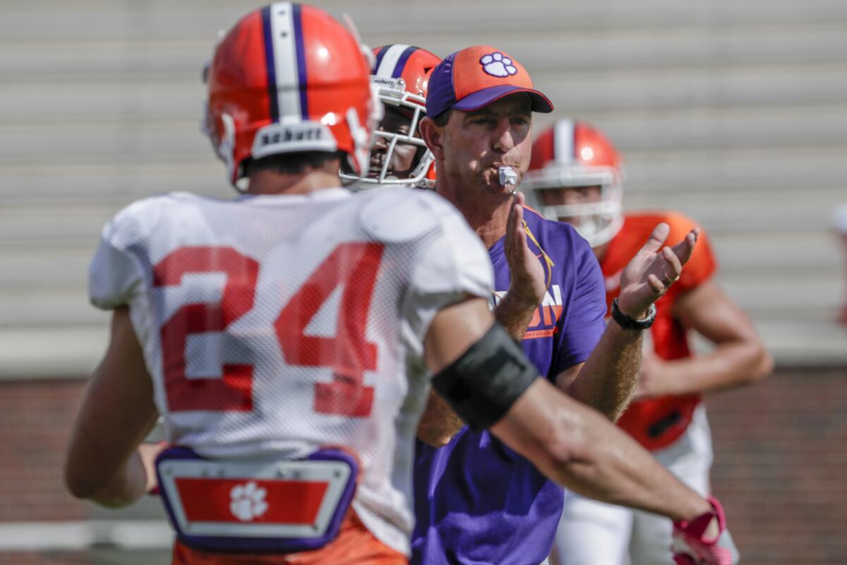 Clemson coach Dabo Swinney conducts a team practice session.