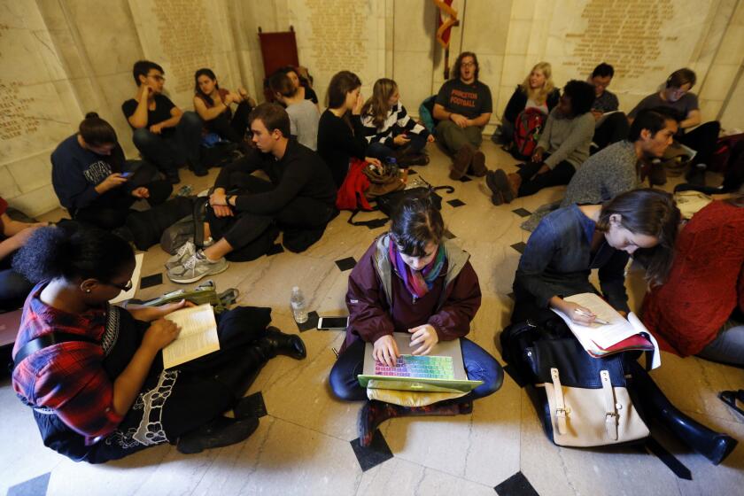 Students gather inside Nassau Hall during a sit-in on Thursday in Princeton, N.J. The protesters demand the school remove the name of former school president and U.S. President Woodrow Wilson from programs and buildings over what they said was his racist legacy.