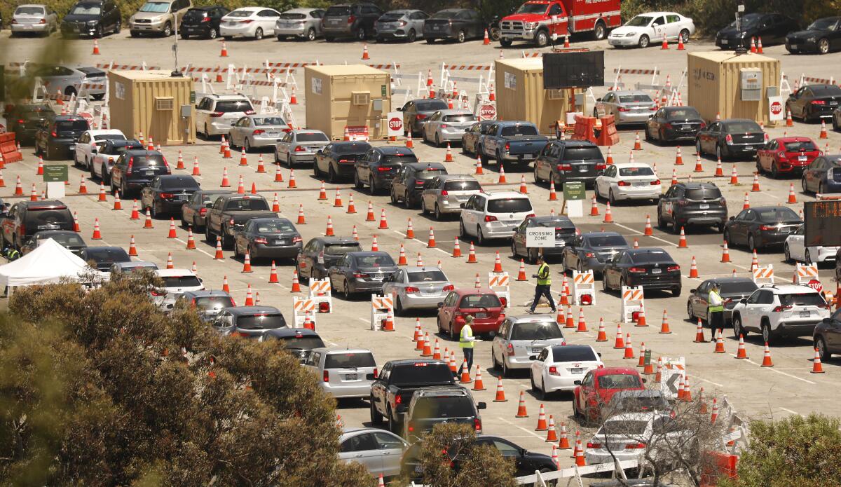 Motorists line up in multiple lanes at Dodger Stadium for coronavirus testing on July 8.