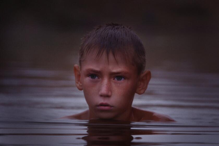 A boy floating in a river