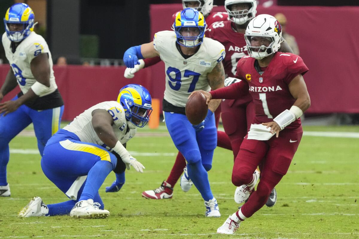 Arizona Cardinals quarterback Kyler Murray runs out of the pocket against the Rams in the second half.