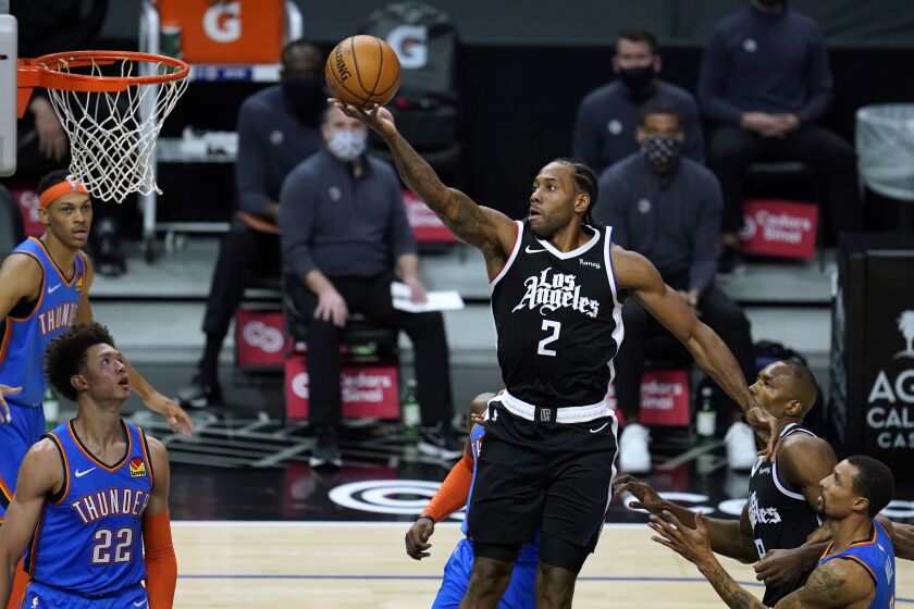 The Clippers' Kawhi Leonard glides to the basket in the first quarter against Oklahoma City on Jan. 22, 2021.