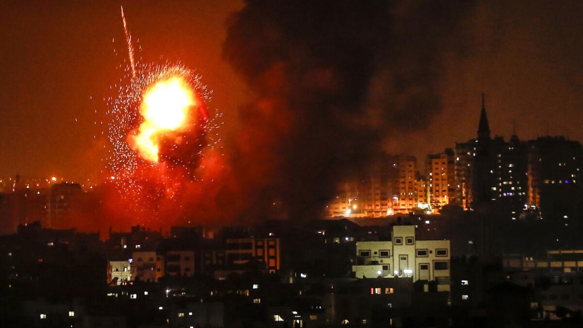 A fireball explodes during Israeli airstrikes in Gaza City on Aug. 8, 2018.