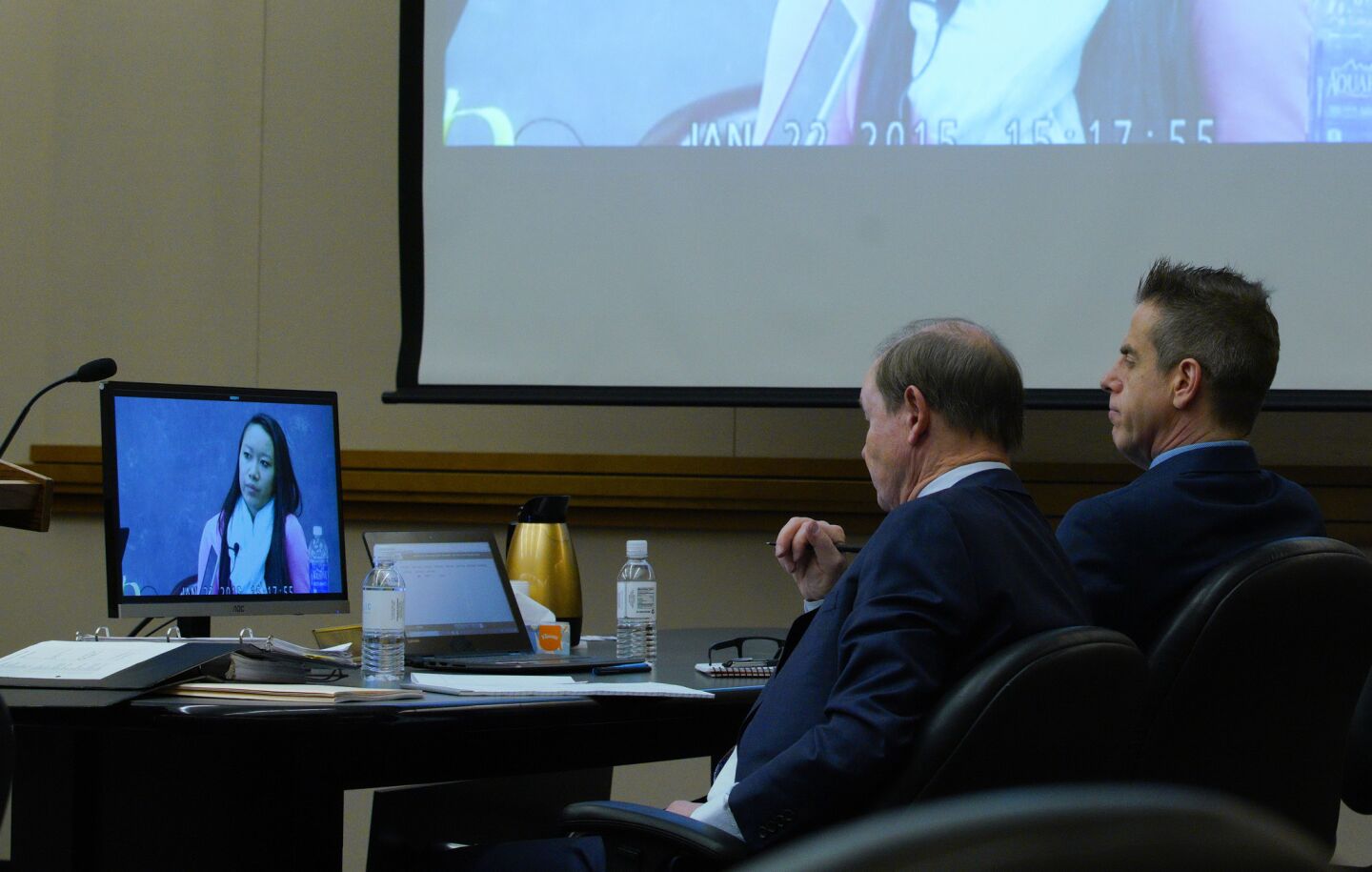 Adam Shacknai (right) sits next to his attorney, Dan Webb as a video is played of Rebecca Zahau’s younger sister Xena Zahau taken during her January 22, 2015 deposition.