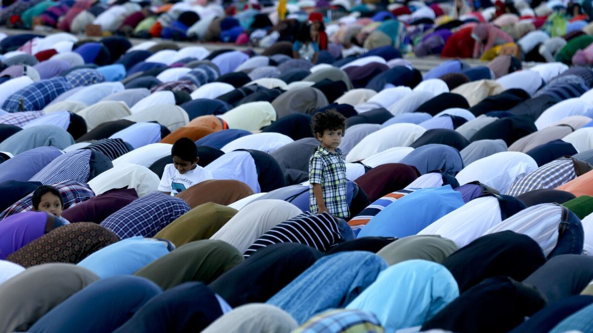 Muslims gather in prayer in 2015 in the parking lot of Angel Stadium in Anaheim for Eid al-Adha, which marks the end of the hajj pilgrimage.