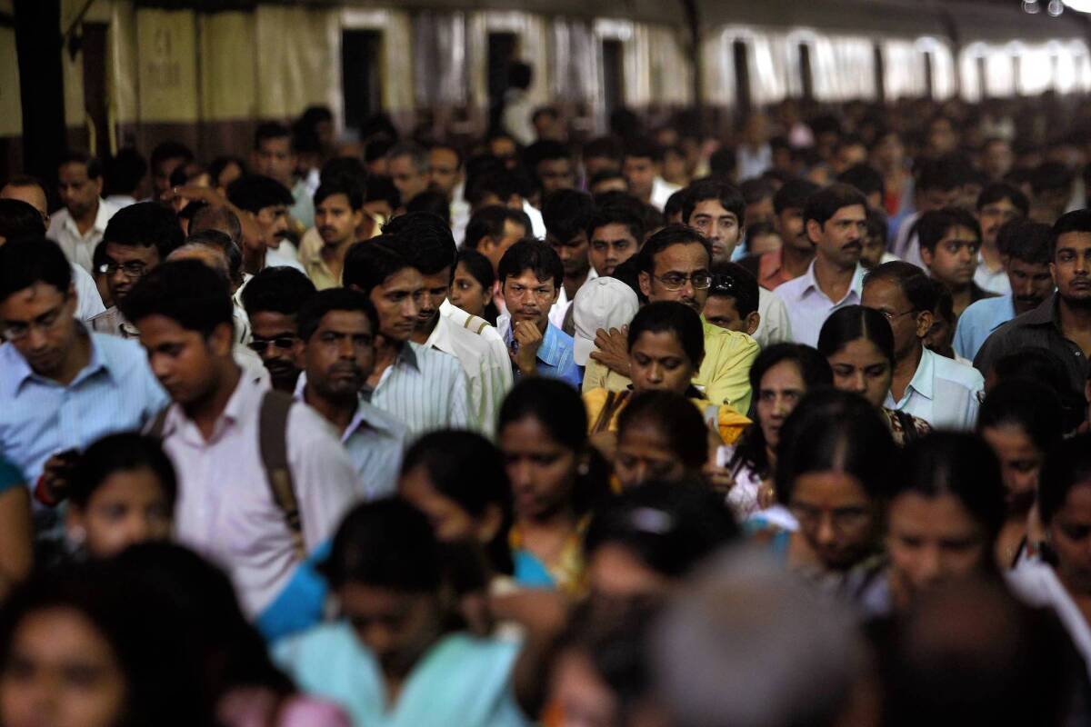 Commuters in Mumbai at the historic Victoria Terminus, one of India's busiest rail station.
