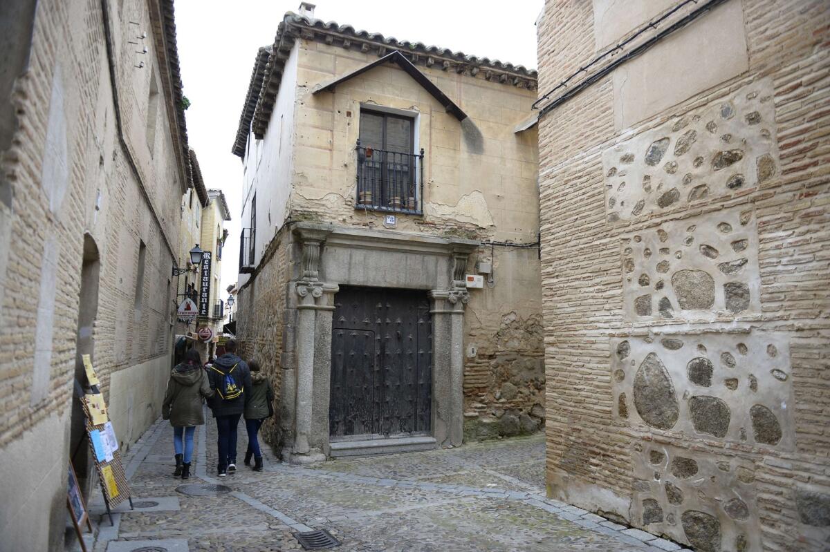 People walk in a street of the old Jewish quarters of Toledo on Feb. 27, 2014. Spain's offer of citizenship to the descendants of Jews who were expelled from the country more than 500 years ago during the Inquisition has set off a flurry of interest around the world.