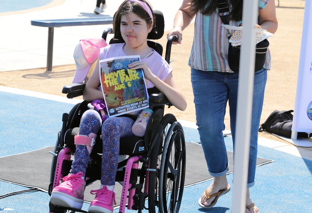 Mila Lent, 11, of Westminster, visited the universally accessible playground at Fountain Valley Sports Park on Friday.