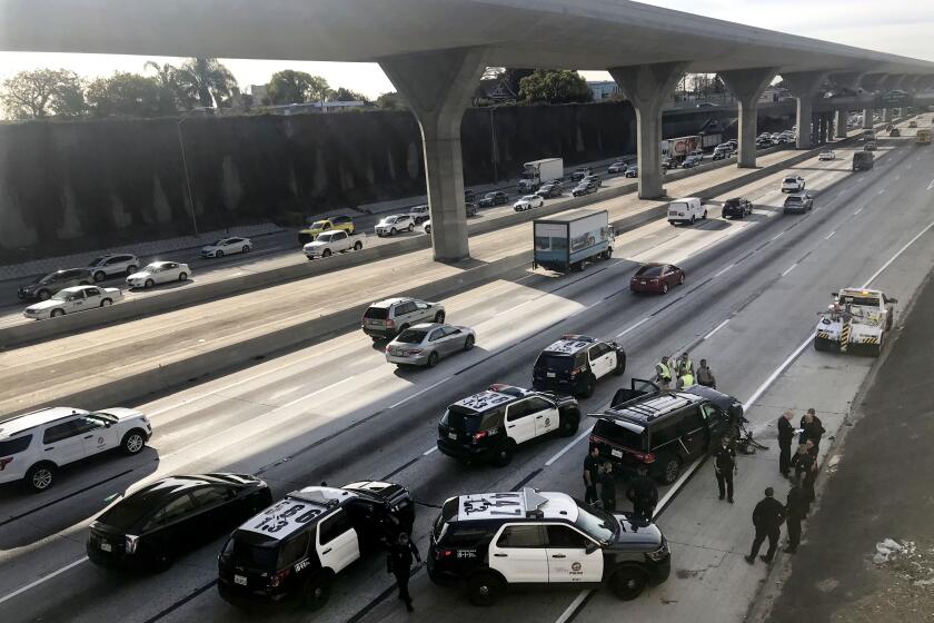 LOS ANGELES CA. FEBRUARY 27, 2020 - An SUV that was carrying a body in a casket and was stolen from a Pasadena church parking lot crashed on the 110 Freeway on Thursday morning during a police pursuit. (Irfan Khan / Los Angeles Times)