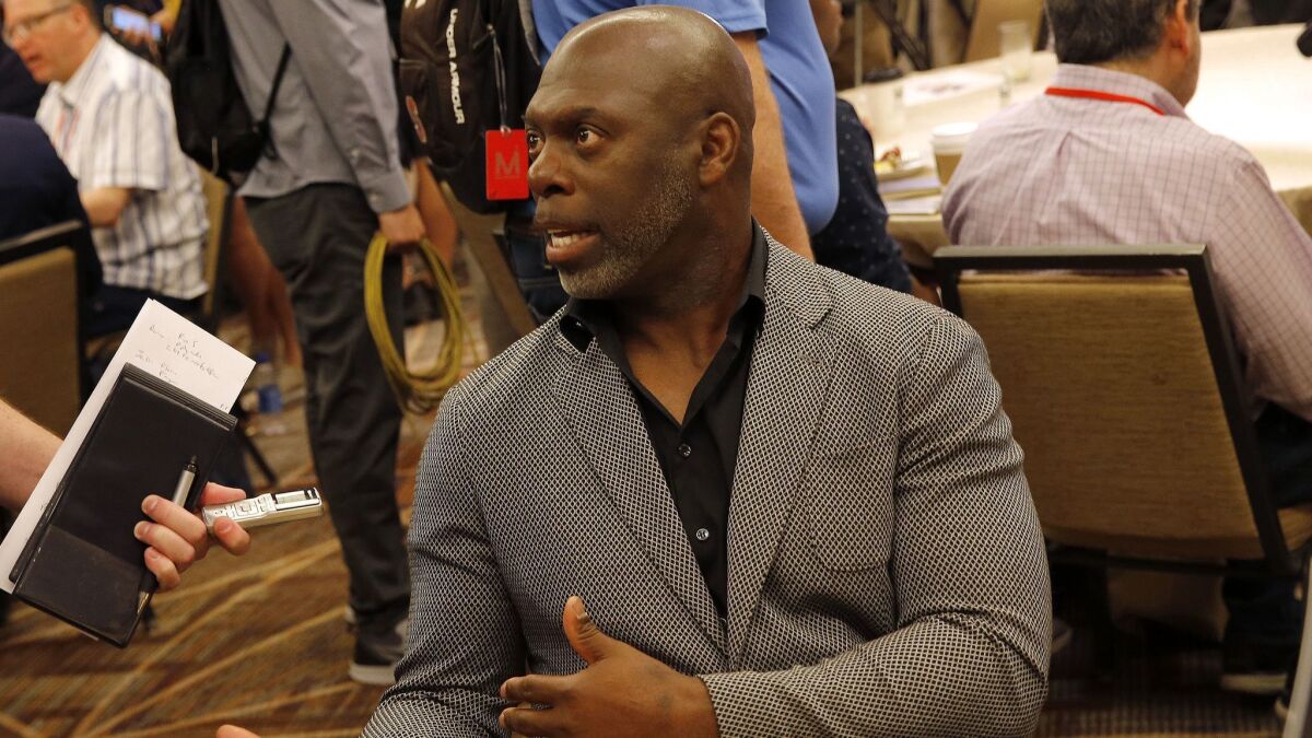 Chargers coach Anthony Lynn speaks to the media during the NFC/AFC coaches breakfast last season.