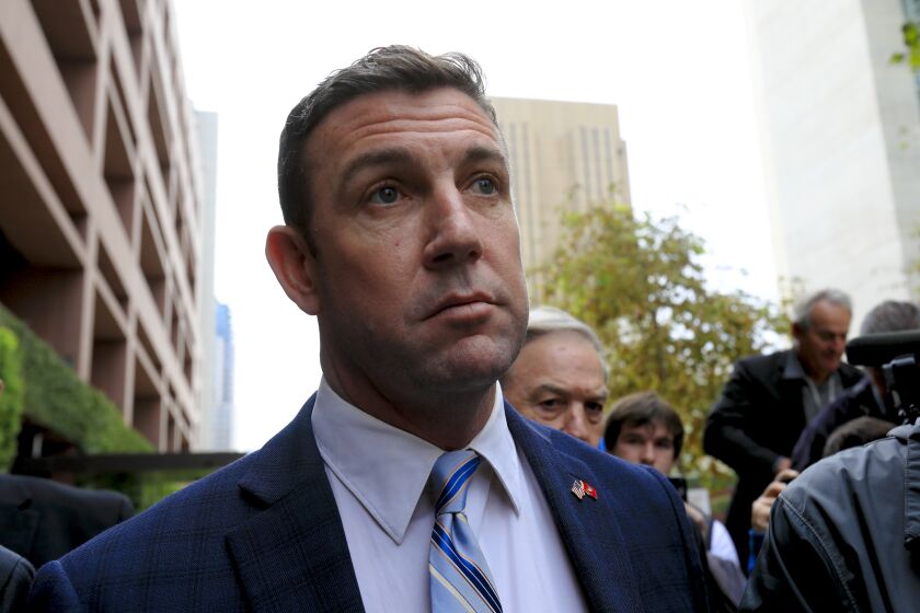 Outside Federal Court in downtown San Diego, Congressman Duncan Hunter along with his attorney, Paul Pfingst spoke with news reporters briefly about his guilty plea in Federal Court before leaving.