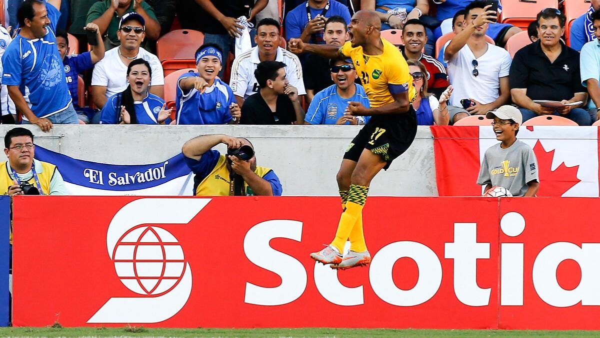 Jamaica's Rodolph Austin celebrates after scoring against Canada in stoppage time during a Gold Cup group game on Saturday night in Houston.