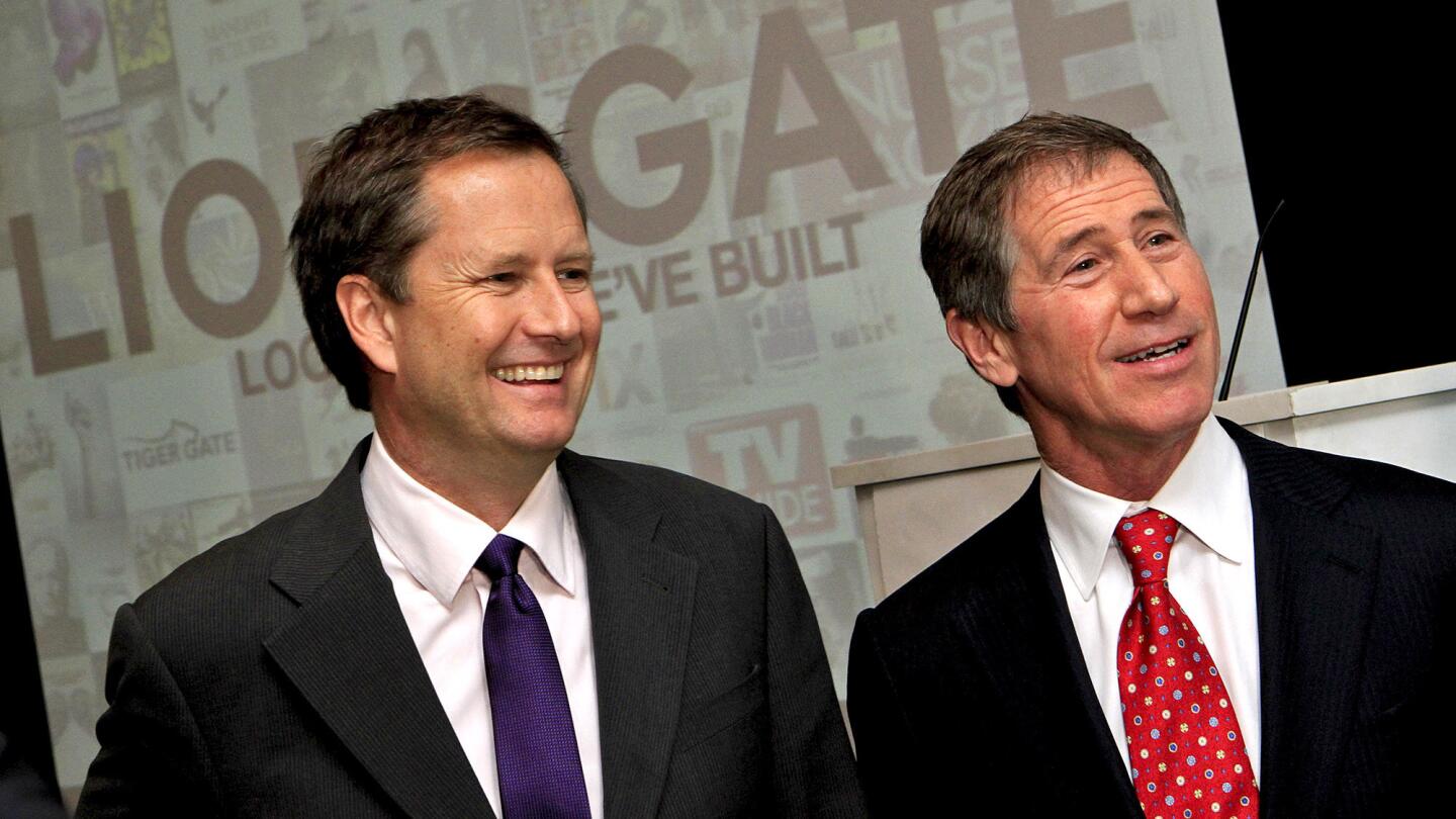 Lionsgate Vice Chairman Michael Burns and CEO Jon Feltheimer speak after a press conference at the SLS Hotel in Los Angeles in 2010.