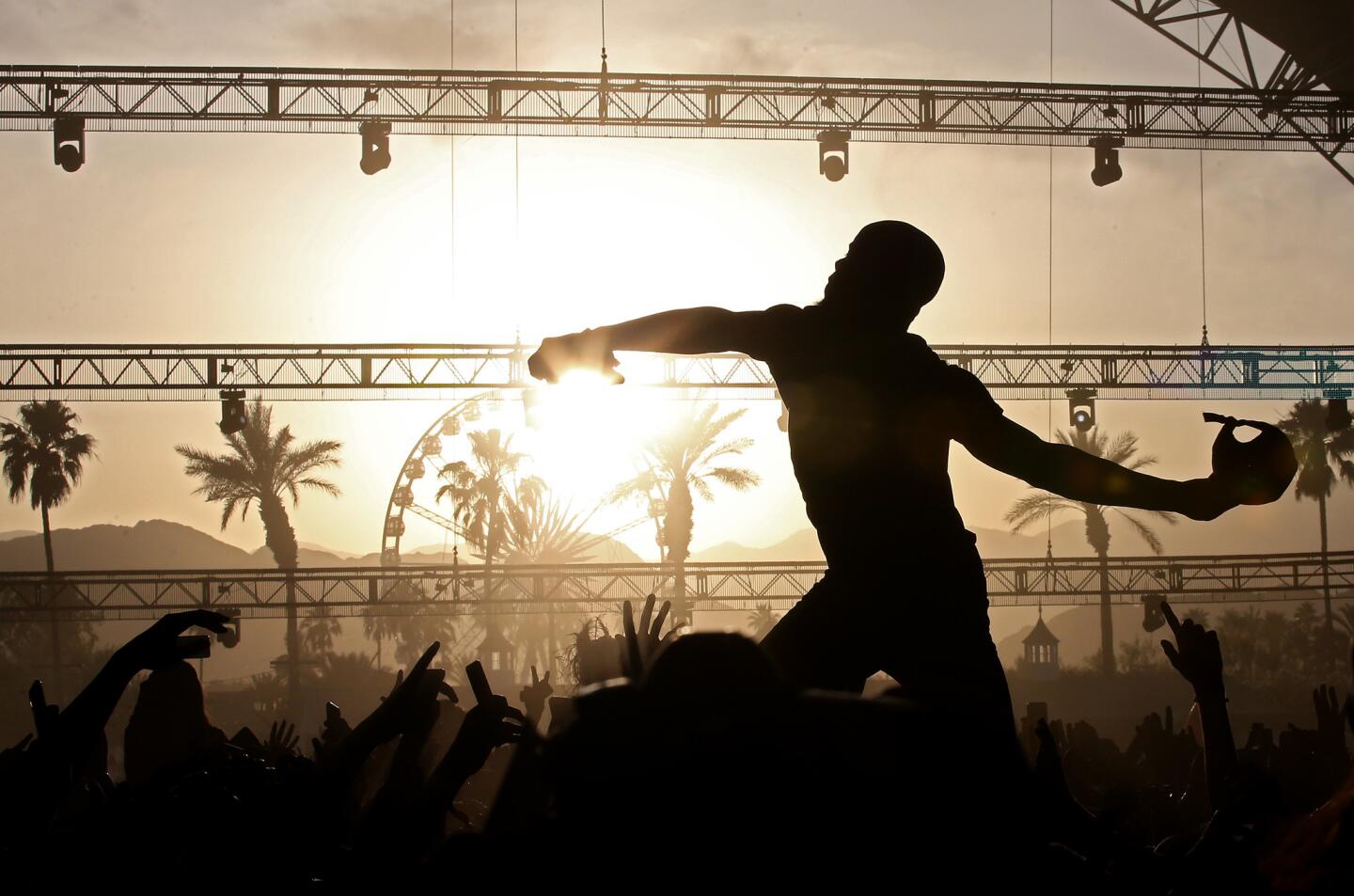 Fans hold up Canadian hip-hop artist Tory Lanez as he wades into the crowd at the Sahara Stage, 2017.