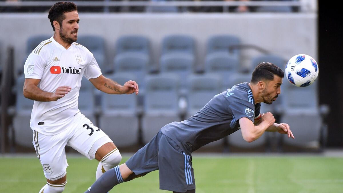 Benny Feilhaber of LAFC, left, and David Villa of New York City FC on May 13 in Los Angeles.