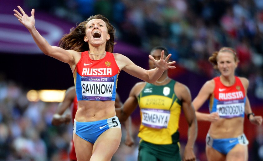 Russia's Mariya Savinova-Farnosova celebrates after crossing the finish line first in the 800 meters at the 2012 London Olympics.