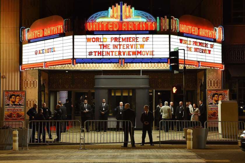 Security personnel stand outside The Theatre at the Ace Hotel before the premiere of "The Interview" in Los Angeles on Dec. 11.