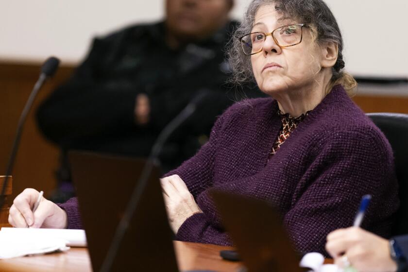 Defendant Susan Lorincz takes notes during her trial Tuesday, Aug. 13, 2024, in Ocala, Fla. Lorincz is charged with manslaughter in the June 2023 shooting of her neighbor Ajike “A.J.” Owens. (Doug Engle/Ocala Star-Banner via AP, Pool)