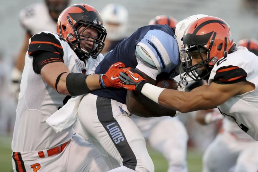 Columbia's Dante Miller #7 in action against Princeton's Anthony Siragusa #94 during an NCAA college football game on Friday, September 28, 2018 in New York. Princeton won the game. (AP Photo/Gregory Payan)