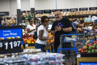 FILE - Shoppers pause in the produce section at a Walmart Superstore in Secaucus, New Jersey, July 11, 2024. (AP Photo/Eduardo Munoz Alvarez, File)