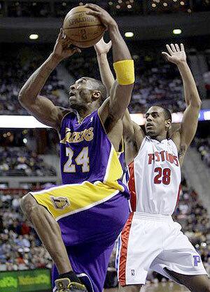 Lakers guard Kobe Bryant drives past Pistons guard Arron Afflalo for a layup in the first half Thursday night.