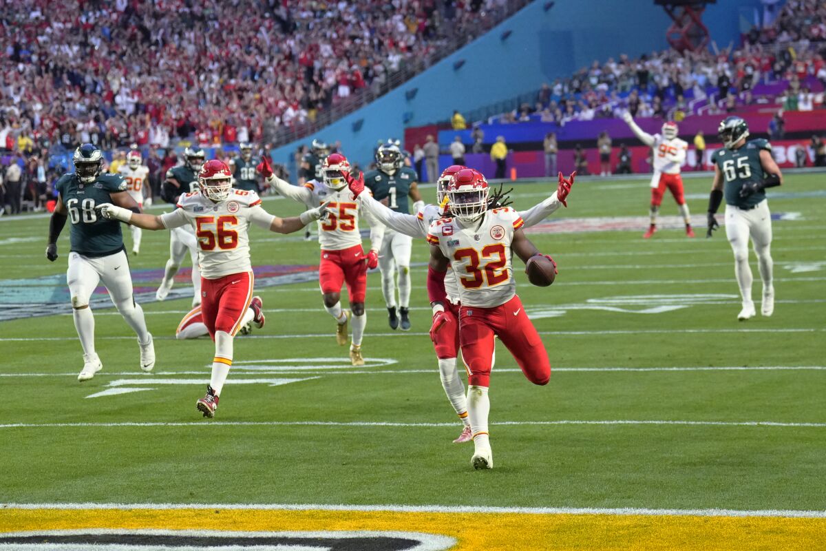 Kansas City Chiefs linebacker Nick Bolton (32) scores a touchdown after recovering a fumble 