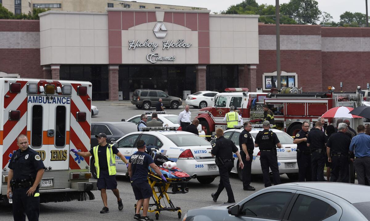 Emergency personnel gather outside Carmike Hickory 8 movie theater in the Nashville community of Antioch on Wednesday after police killed a suspect wielding a hatchet, pepper spray and a pellet gun.