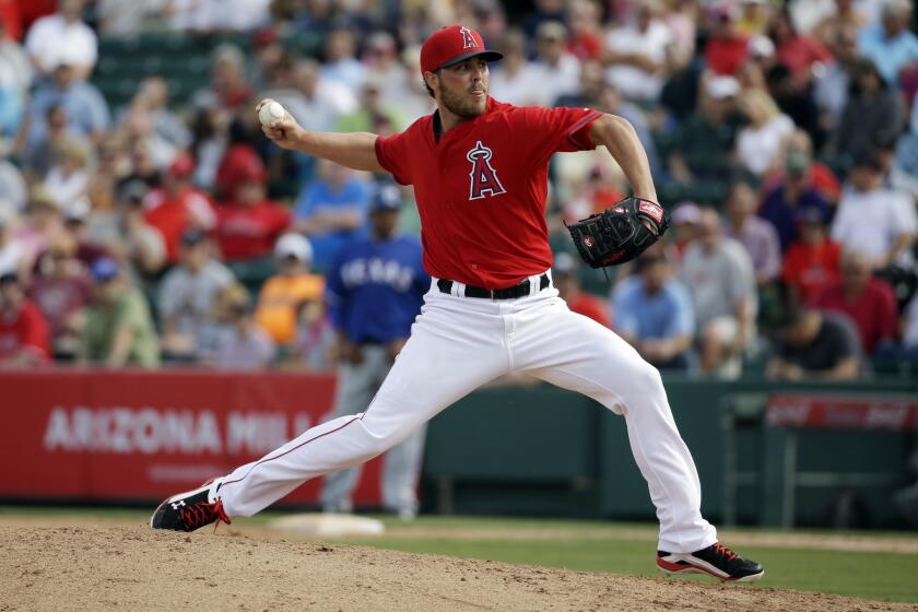 Angels reliever Michael Kohn delivers a pitch during an exhibition game against the Texas Rangers in March.