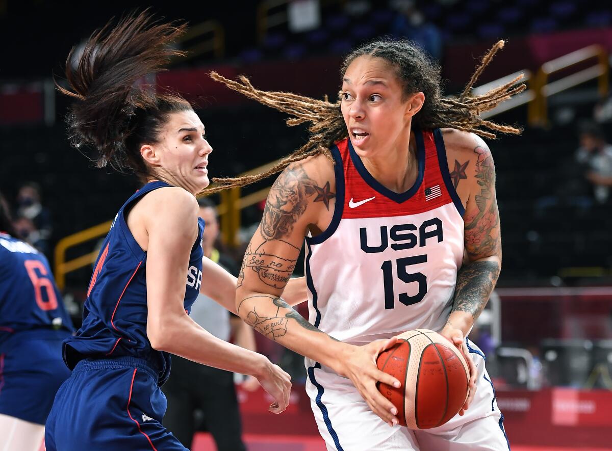 U.S. center Brittney Griner puts a spin move on Serbia's Dragana Stankovic.