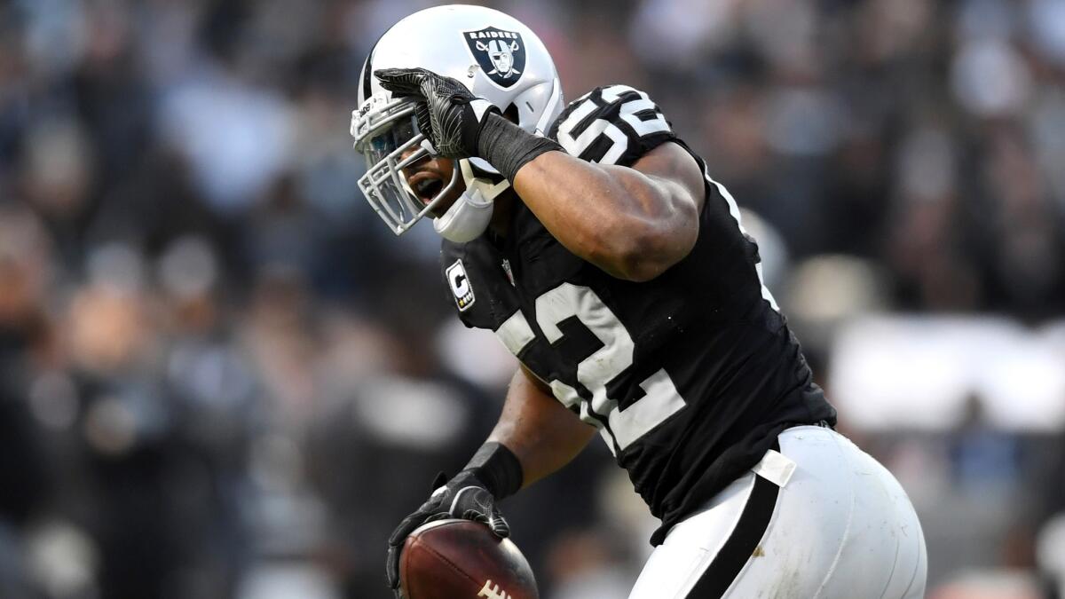 Raiders linebacker Khalil Mack celebrates after recovering a fumble during a game against the Bills on Dec. 4.