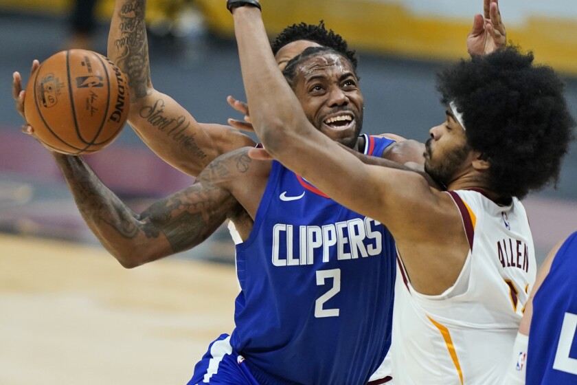 Clippers' Kawhi Leonard looks to score against Cleveland Cavaliers' Jarrett Allen.