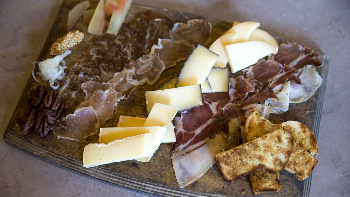 A board of cured meat, brioche bread, and cheese, all made at Scratch Bar & Kitchen in Encino.
