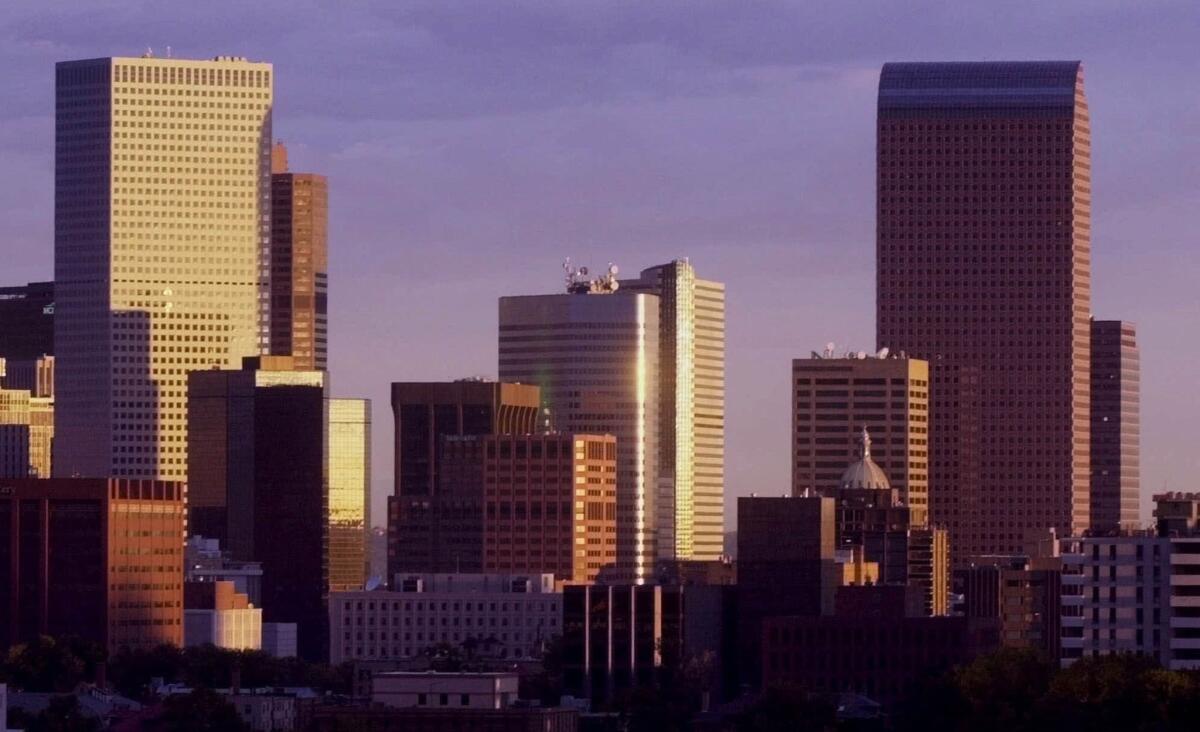 Sunlight reflects off Denver's skyline.