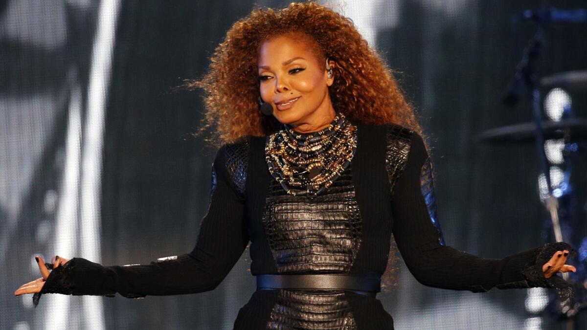 Janet Jackson performs at the World Cup in Dubai on March 26 -- her last show before postponing her tour for family-planning reasons.